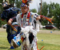 young boy Wind River Indian dancer doing the Men's Grass Dance