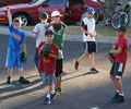 Fans waiting for foul balls outside the fence