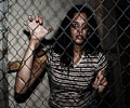 beautiful girl kept in cage at Morbid Nights Haunted House